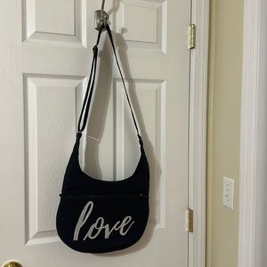 Lug black canopy bag with the word love on the front. Great condition.